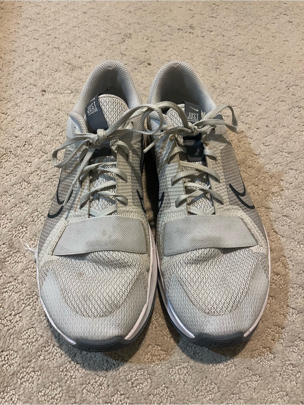 Nike Men’s Light Gray Athletic Training Shoes with Black Swoosh